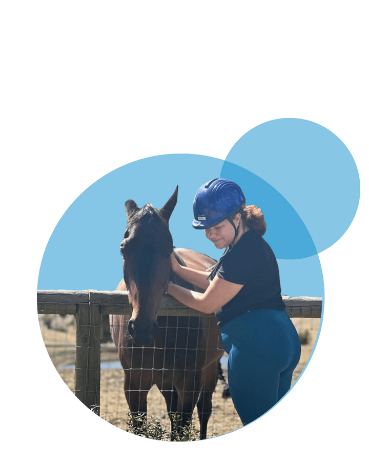 Vana Care participant spending time with a horse on an outdoor outing