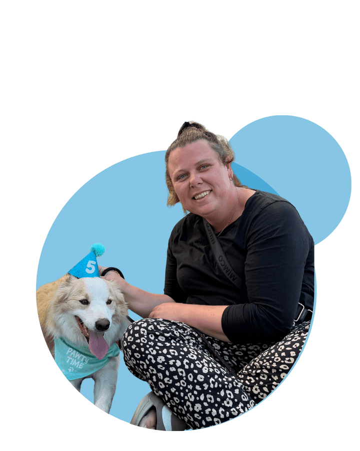 Vana Care team members with a puppy at a community event